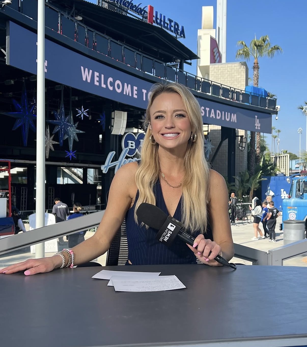 Nikki Kay at the Spectrum News 1 desk outside Dodger Stadium