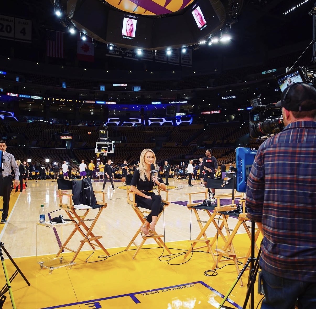 Nikki Kay reporting courtside at a Los Angeles Lakers game
