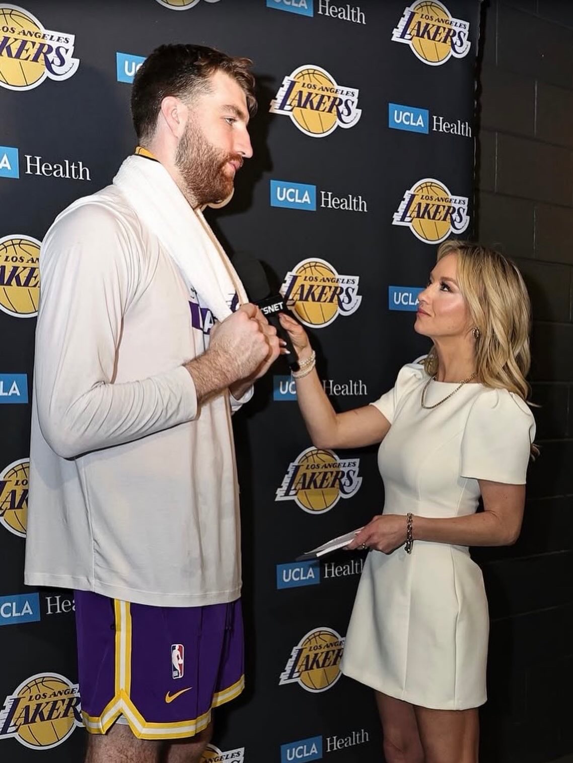Nikki Kay interviewing a Los Angeles Lakers player postgame