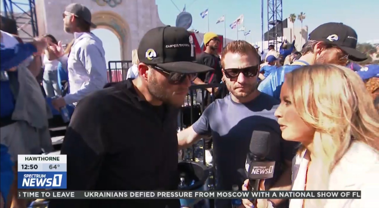 Nikki Kay interviewing Rams coaches at the Super Bowl victory parade